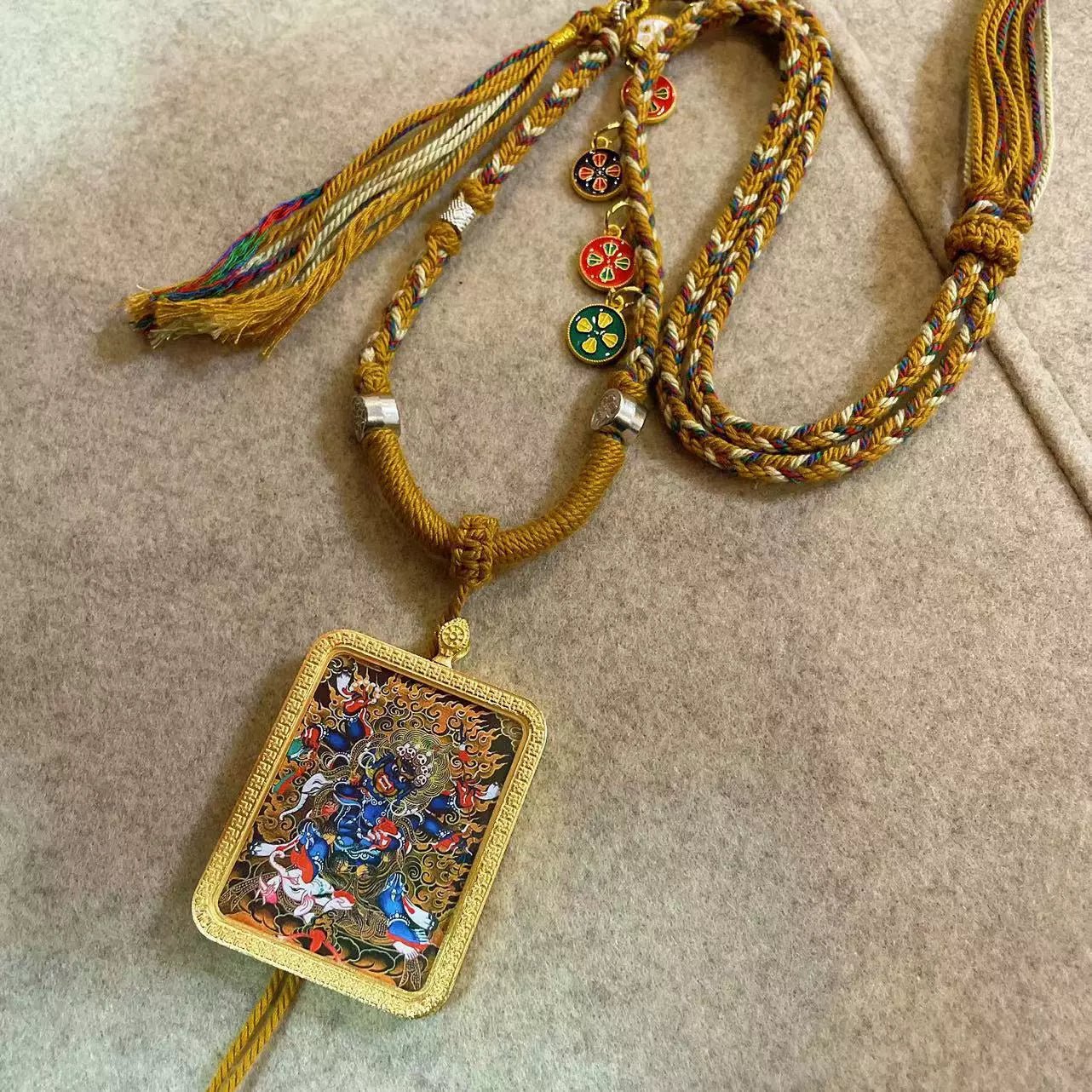 six armed mahakala handcrafted gold tibetan thangka necklace with soft yarn cord4 17.jpg