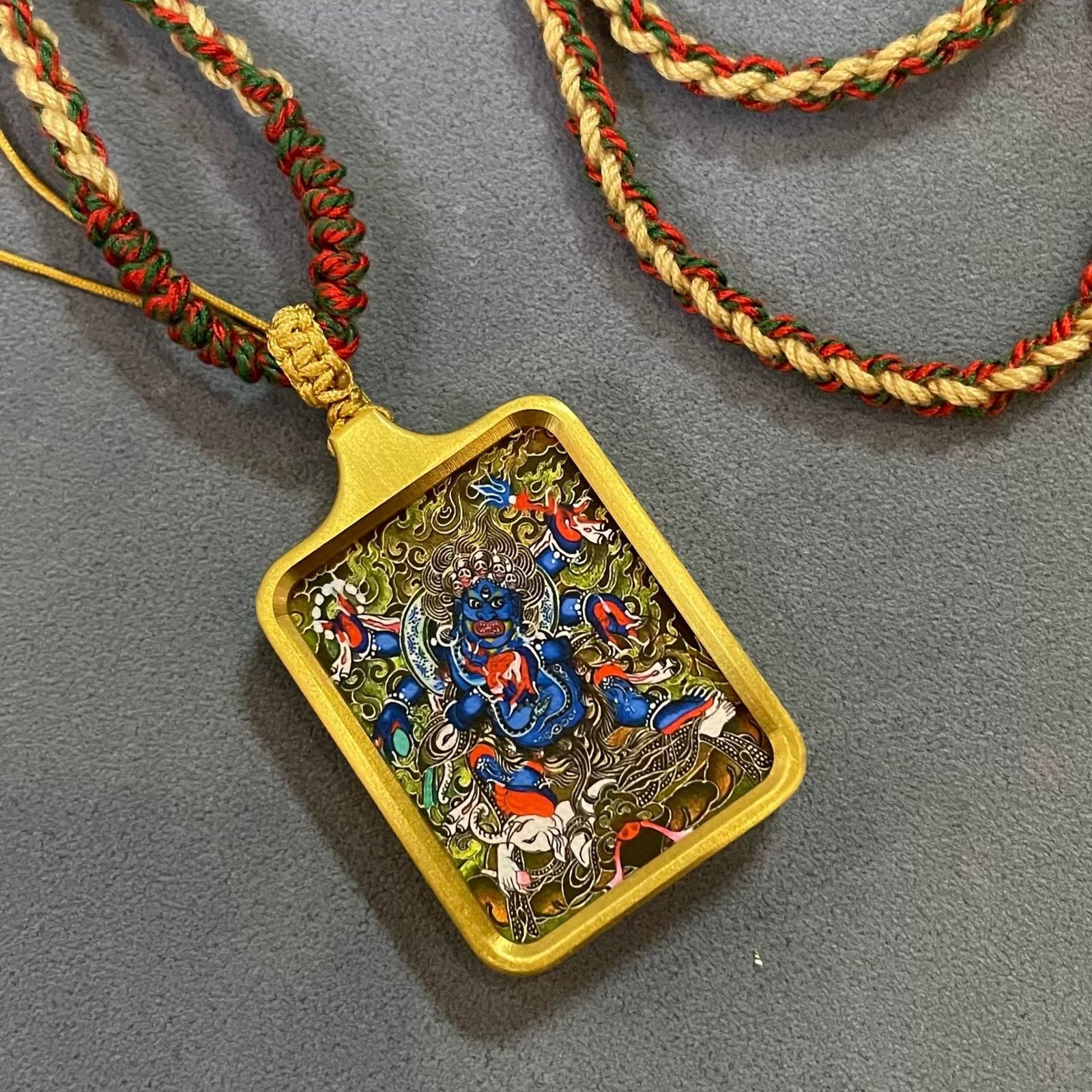 six armed mahakala solid brass tibetan thangka pendant with handwoven cord six armed mahakala solid brass tibetan thangka pendant with handwoven cord