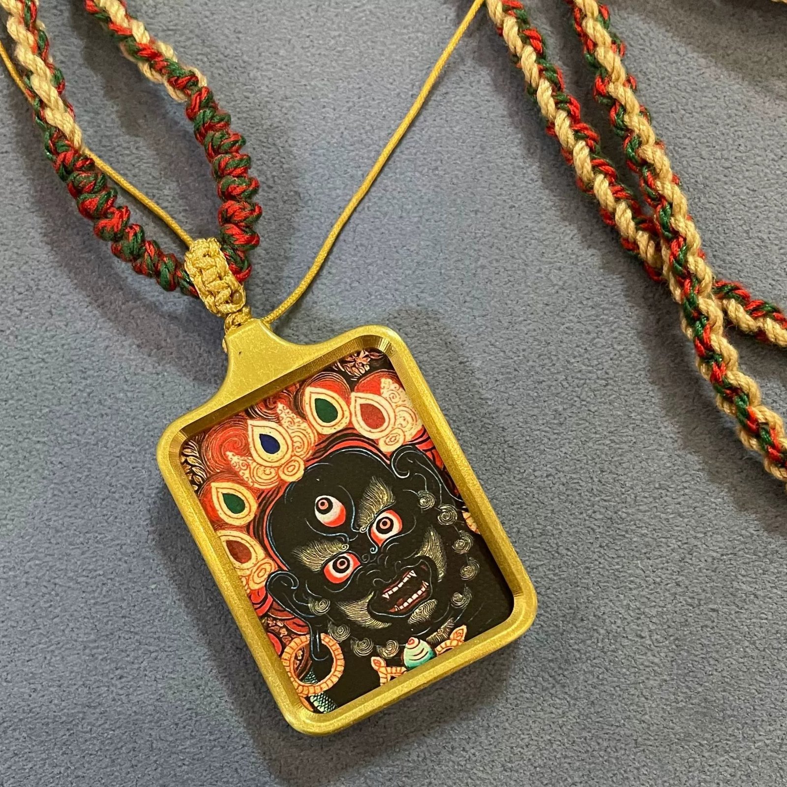 six armed mahakala solid brass tibetan thangka pendant with handwoven cord six armed mahakala solid brass tibetan thangka pendant with handwoven cord