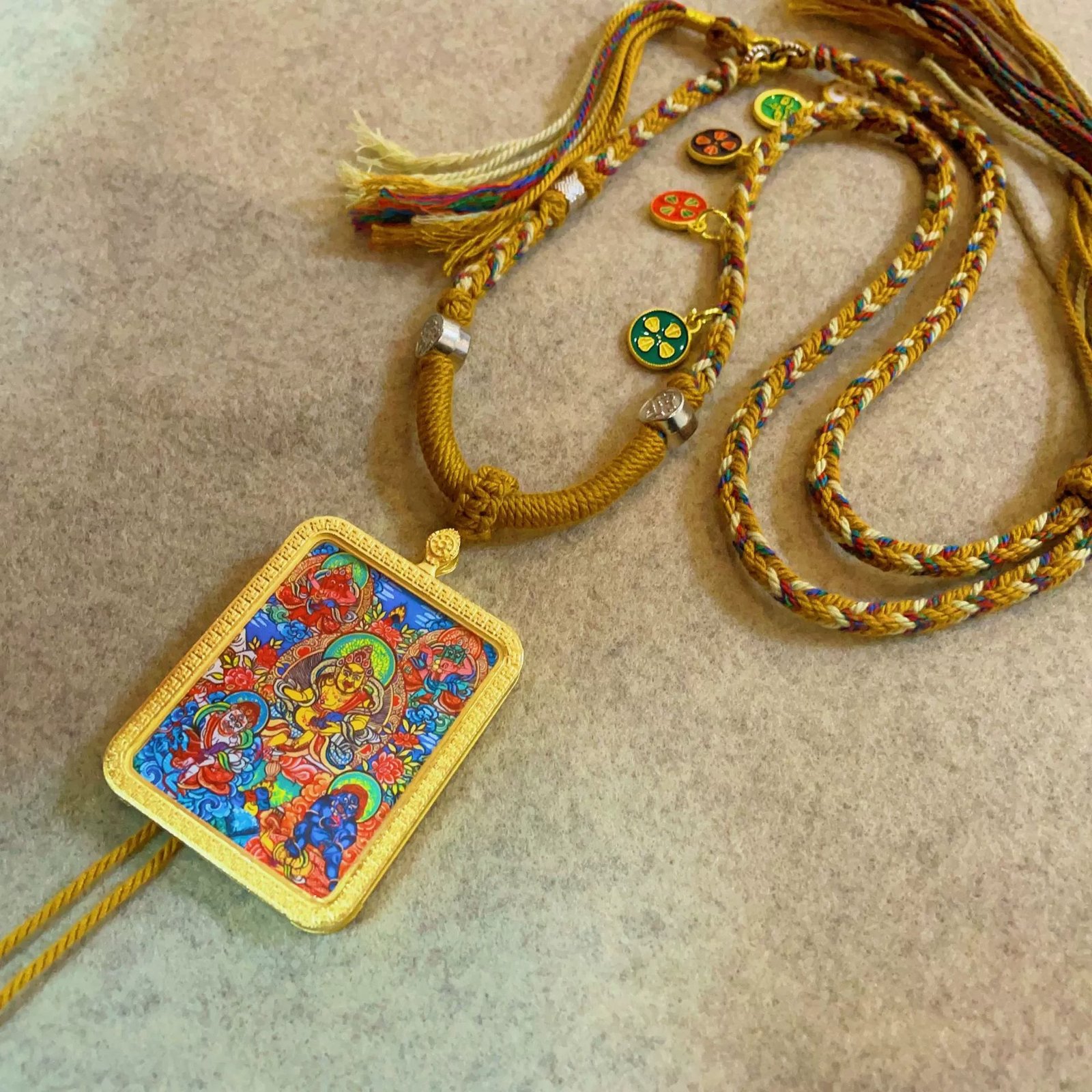 the five jambhalas god of wealth handcrafted gold tibetan thangka necklace with soft yarn cord4 9.jpg the five jambhalas god of wealth handcrafted gold tibetan thangka necklace with soft yarn cord4 9.jpg
