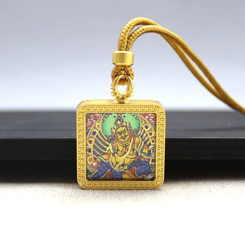 yellow jambhala (god of wealth) mini square gold tibetan thangka pendant – sacred protection amulet (gold leaf decorated) yellow jambhala (god of wealth) mini square gold tibetan thangka pendant – sacred protection amulet (gold leaf decorated)