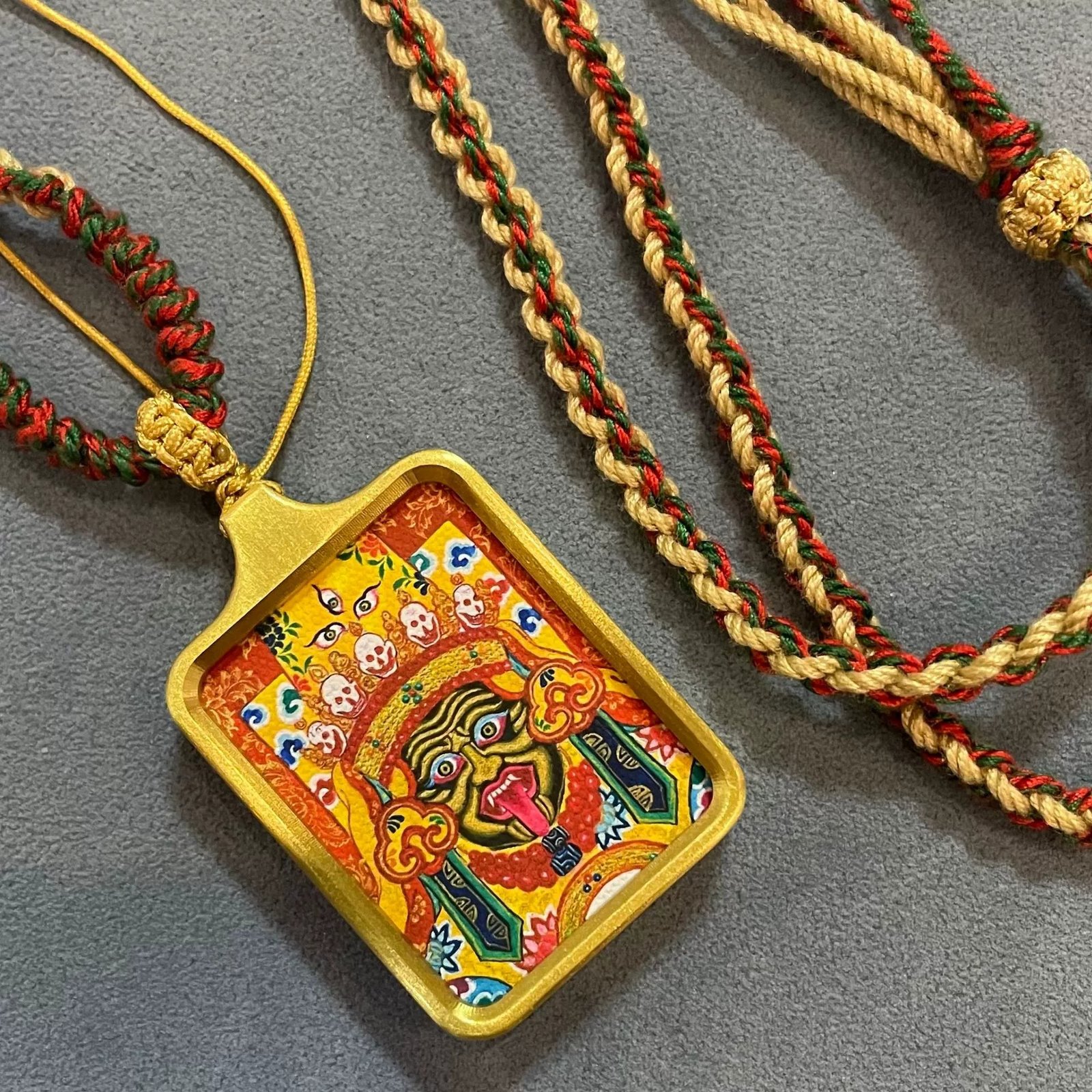 zashi lhamo (god of wealth) solid brass tibetan thangka pendant with handwoven cord